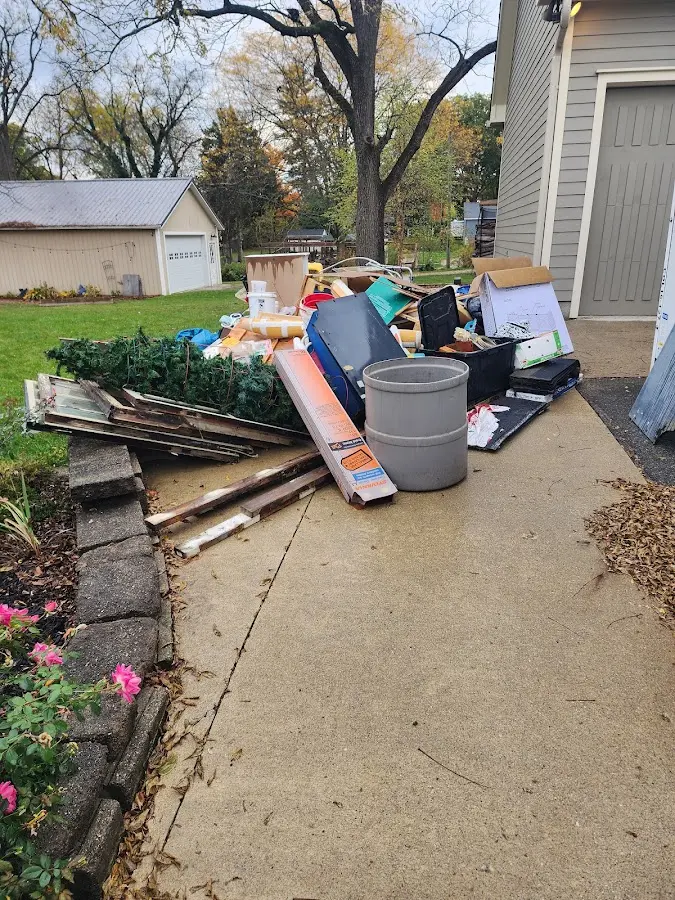 Dumpster being loaded with debris for Estate Cleanout Dumpster Rental in One Loudoun